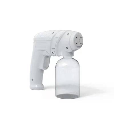 China Disinfect Machine Rechargeable Handheld Blue Nano Light Atomizer Nano Mist Spray Gun for sale