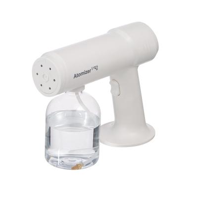 China Disinfect Hot Sale 500ml Refillable Nano Sprayer Blue Light Cordless Sterilization Gun for sale