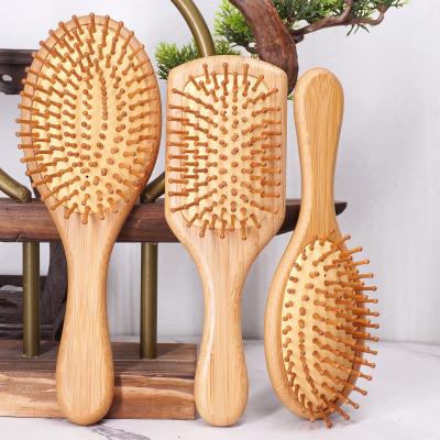 China Custom Logo Air Cushion Pad Bristle Wooden Paddle Brush Natural Bamboo Detangling Hair Brush for sale