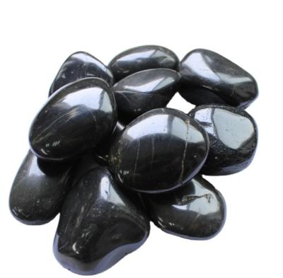 China Modern Super Polished Stone Black River Stone For Paving for sale