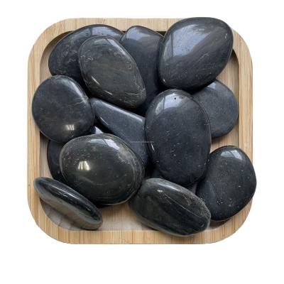 China Modern black pebble highly polished stone for sale