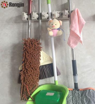 China Wall Mounted Broom Organizer Suction Cup Suction Cup Broom and Mop Stand for sale