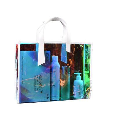 China Custom PVC Gift Handbag Radium Woman Bag Shooter Bag Handled Transparent Magical Jelly Shopping Bag for sale