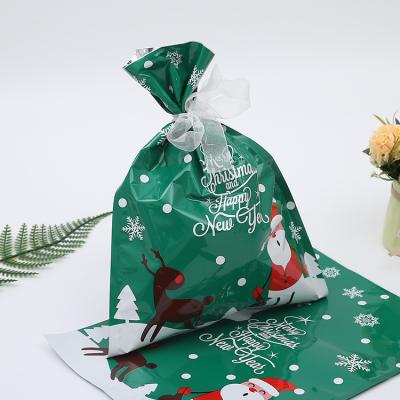 China Aluminum Foil Christmas Party Drawstring Boutique Gift Wrapping Bag Candy Gift Bag for sale