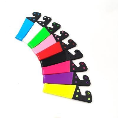 China Waterproof Plastic Flexible V-shaped Portable Lazy V Bracket Mobile Phone Holder Stand Mobile Phone Bracket for sale