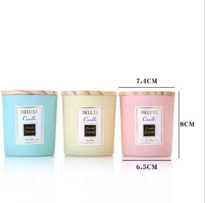 China Religious Activities Empty Matte Black White Blue Pink Glass Candle Jar With Wooden Lid for sale