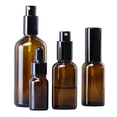 China 30ml 50ml 100ml personal care empty amber frosted fine mist sprayer glass bottle esssention fine oil bottle for sale