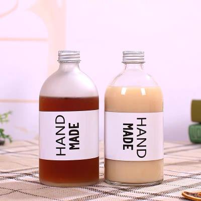 China Portable Custom Clear Frosted Empty Round 350ml 500ml Beverage Cold Brew Coffee Juice Bottle Beverage Drinking Milk Glass Water Bottle for sale