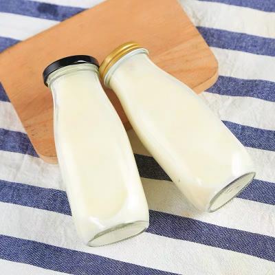 China Beverage 250ml 500ml 750ml 1000ml 1L Juice Milk Tea Glass Bottle sealed eco-friendly with mental lid for sale