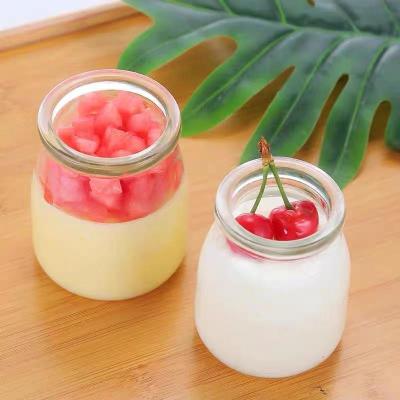 China Stored empty egg shaped wide glass jar milk pudding yogurt mouth glass bottle with lid dessert jar for pudding for sale