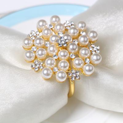 China Wholesale stocked DEACORY new style pearl diamond table decoration gold kirsite metal hotel restaurant napkin ring for wedding for sale