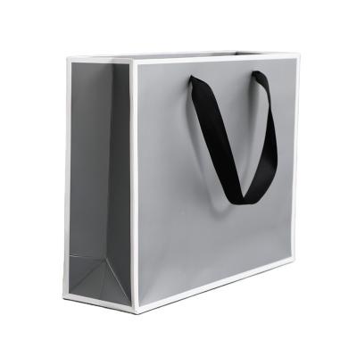 China Recyclable High End Custom Gray Shopping Bag With LOGO Handle Luxury Paper Bag for sale