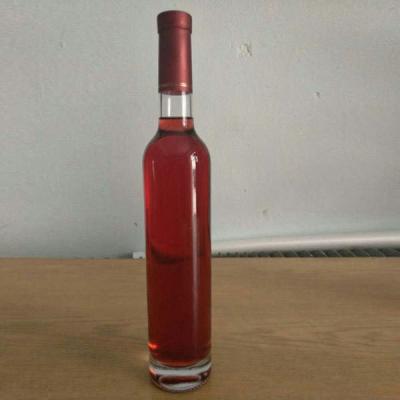 China Impresión de logotipo personalizable de vidrio redondo delgado y alto Botellas de vodka con sello de corcho en venta