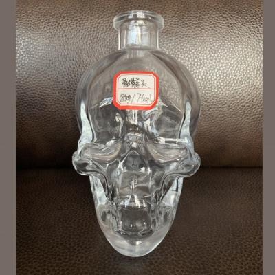 China Decal 1000ml Surface Handling Skull Glass Bottle for Spirit Bong for sale