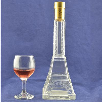 China Material de vidro de pedra em relevo de alta torre Eiffel forma de vidro garrafa de licor com cortiça à venda