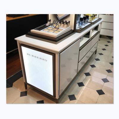 China Guangzhou-ZX Mall High-end Cosmetic Counter Kiosk Cosmetic Furniture Display Cosmetic Display Table for sale