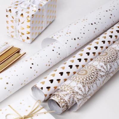 Cina ELEGANT WHITE & GOLD wrapping paper christmas gift wrapping paper rolls Wholesale christmas wrapping paper in vendita