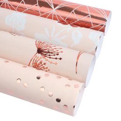 China ROSE GOLD FOIL Custom Printed Wrapping Paper Roll Colorful Tissue Paper Gift Wrapping Paper Manufacturer for sale