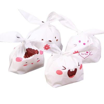 China 100pcs/bag Disposable Baked Candy Gift Packaging Rabbit Ears Dessert Bag Large Plastic Snack Snowflake Pastry Bag for sale