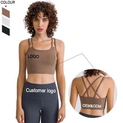 China Antibacterial Women Workout Clothes Gym Bare Crop Feeling Two Straps Sports Yoga Top Cross Back Bra for sale