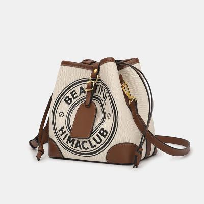 China Portable High Quality Women Splicing Canvas And Leather Cross - Body Bucket Bag Female Coffee Color Single Chain Shoulder Bags for sale