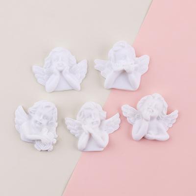 China Yiwu global insheen the cabochon style fancy white color angel design flatback resin figure fairy craft for sale