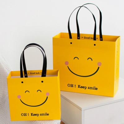 China BIODEGRADABLE Eco Friendly Printing Keep Smiling Logo Kraft Paper Bag Small Small Brown Paper Bag With Handles for sale