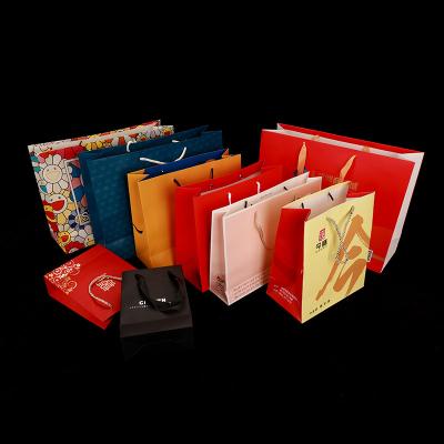 China Recyclable Wholesale Custom Printed Silver Luxury Small Shopping Gift Paper Bag Bagpaper Pera Paper Bag With Handle for sale