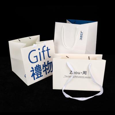 China Recyclable Paper Bag With Handles High Quality Candy Cookie Gift Festival Gift Pouch Shopping Packaging Bags for sale