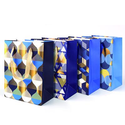 China Luxury Custom Materials Daily Gold Foil Recycled Gift Blue Paper Bags for sale