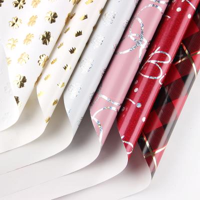 China Beautiful Recyclable Custom Holographic Gift Wrapping Paper Rolls Wholesale Christmas Wrapping Paper for sale