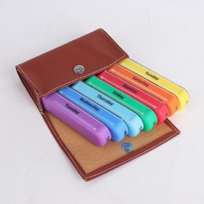 China Portable and Easy to Carry Weekly 7 Days Medicine Pocket Travel Organizer Faux Leather Pill Storage Case for sale