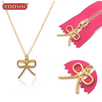 China ALLOY Gold Plated Necklace Dual Use Bow Charm Puller Pendant Charm for sale