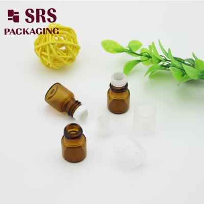 China SRS empty 1ml amber glass roll on perfume bottle with clear plastic cap à venda