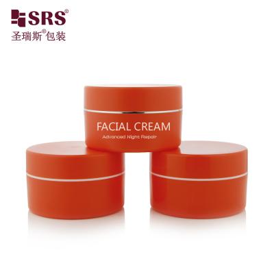 China SRSJK-100g Empty Manufacture Solid Orange Color Plastic Jar Set With Gold Collar Line White Logo Printing For Balm Creams And Moisturizers à venda