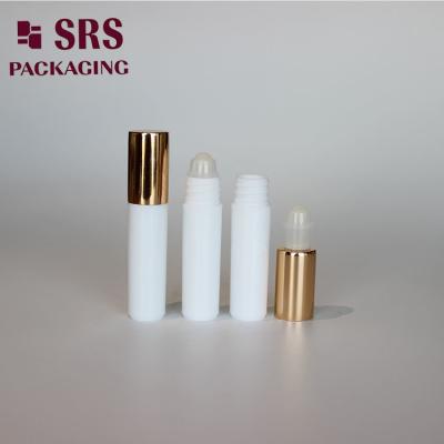 China SRS empty cosmetic 5ml white plastic roller bottle with gold aluminum cap à venda