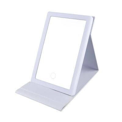 China Lighted NEW Outdoor  Ultra Thin Travel Style Customizable  PU  Leather  Portable 60 Lights LED Mirror Foldable  Makeup Mirror for sale