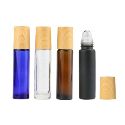 China 5ML 10ml Clear Amber Blue Cosmetic Matte Black Roll On Glass Bottles With Metal Ball 1/3 Ounce For Perfume Oil Cosmetic Packaging for sale