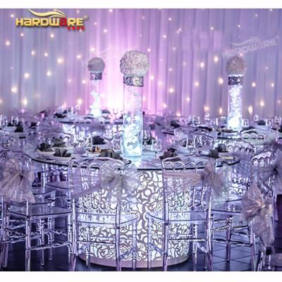 China Customized hot sale 6 seater led round glass dining table with stainless steel chairs for sale