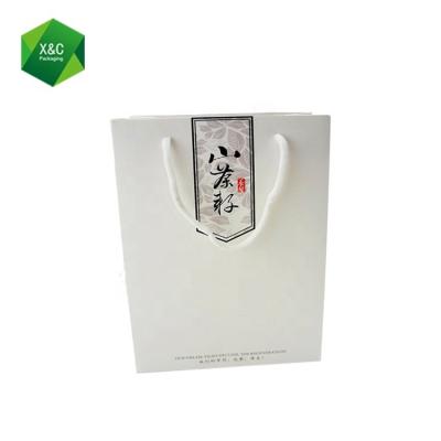 China Recyclable Custom Recycled White Tissue Packaging Craft Kraft Paper Bags With Handles Design for sale