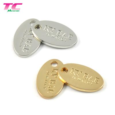 China CLASSIC Trendy Oval Shape Custom Engraved Metal Jewelry Charms Gold Jewelry Tags For Jewelry for sale