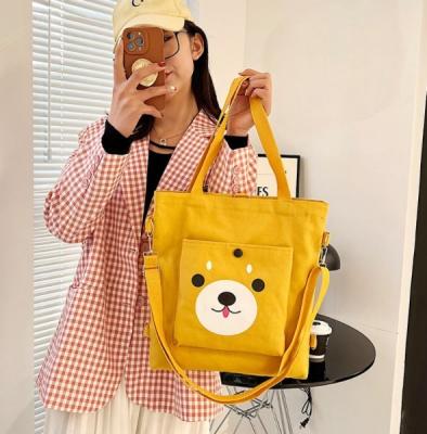 China Students cartoon school bag cotton canvas tote bag stock custom printing handled shopping bag with pocket for sale