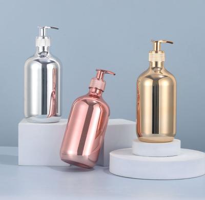 China Cosmetic luxury PET electroplating gold and silver round plastic lotion bottle with pump for shampoo conditioner shower gel bottle for sale