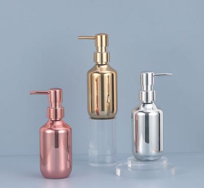 China Gold Bottle 200ml 300ml 400ml 500ml Cosmetic Gold Plated Bottle Cosmetics Plastic Bottle for sale