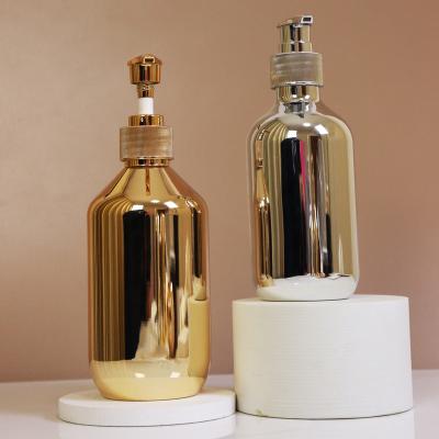 China Cosmetic in Stock 300ml 400ml 500ml Silver Gold Body Lotion Pump Empty Luxury Plated Cosmetic Bottles for sale