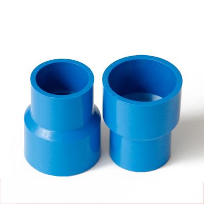 China Plastic Water Supply Pipe Fittings Or Furniture Fittings UPVC Water Supply PVC Reducing Coupling for sale