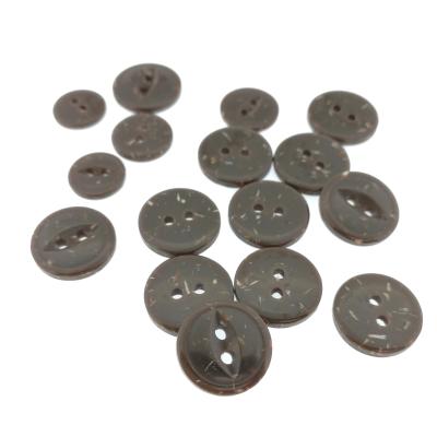 China Newest viable popular dry cleaning four eyes buttons for fabric for sale