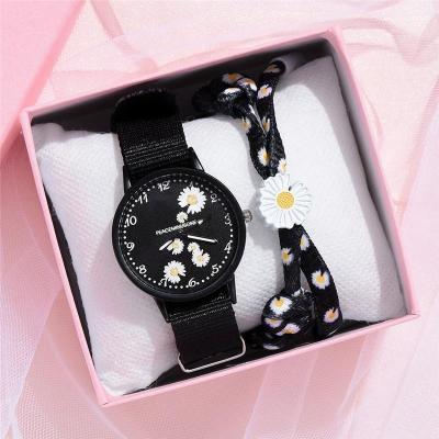 China Women's Nylon Small Daisy Wrist Watch Chrysanthemum Quartz Watch Women Strap Dress Fashion Luxury Girl's Birthday Gift for sale