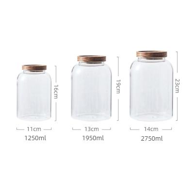 China Dry Beans Cookie Canister Large Freshness Preservation Cereal Fruit Glass Jar With Tall Jar Wooden Borosilicate Candy Lid Clear Glass Storage Jar for sale