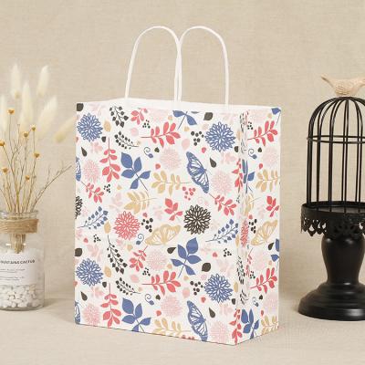 China Disposable Manufacturers Price Custom Logo Colorful Flower Kraft Paper Gift Shopping Bag With Handles for sale